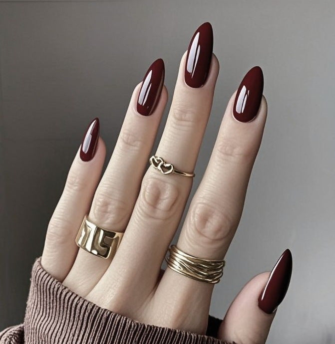 Long almond press-on nails in deep burgundy