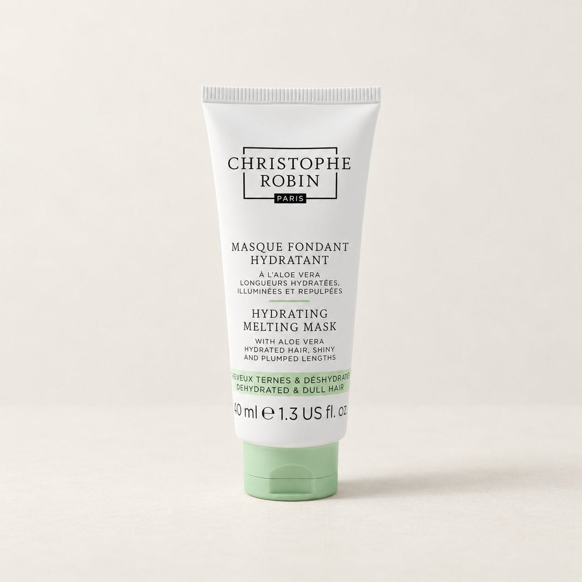 Christophe Robin Hydrating Melting Mask on a pale stone surface (styled image)
