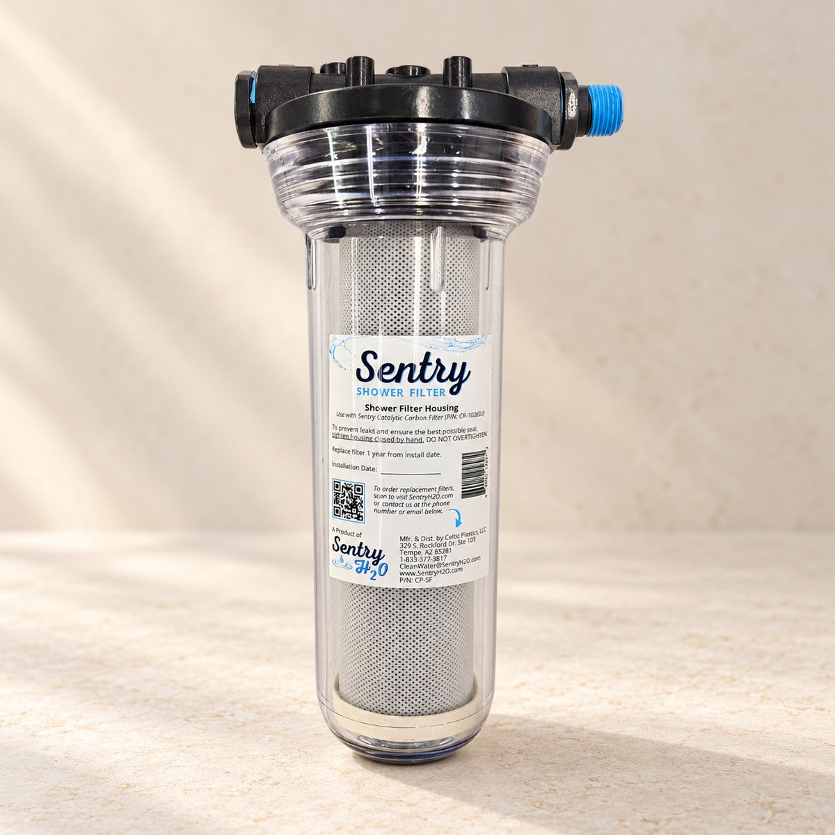 Sentry Shower Filter on a pale stone surface (styled image)